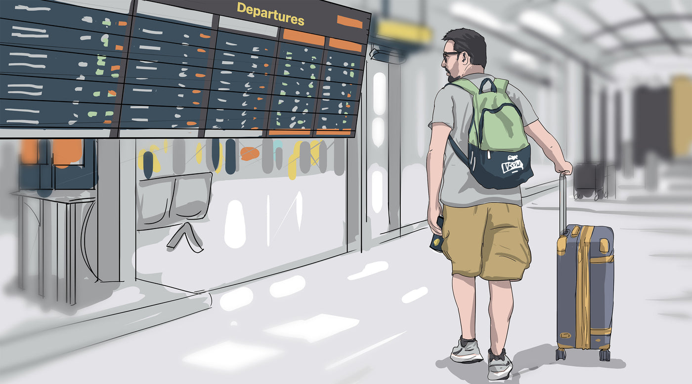 An airport dad checking the departures board again