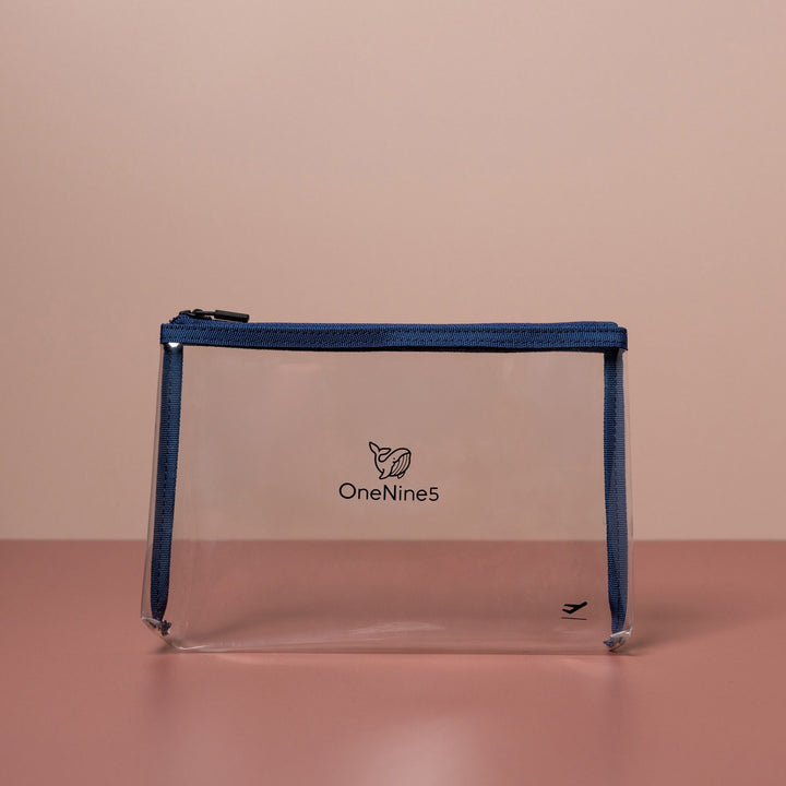 Blue clear liquid bag for airport security shown front-on with transparent design and structured shape