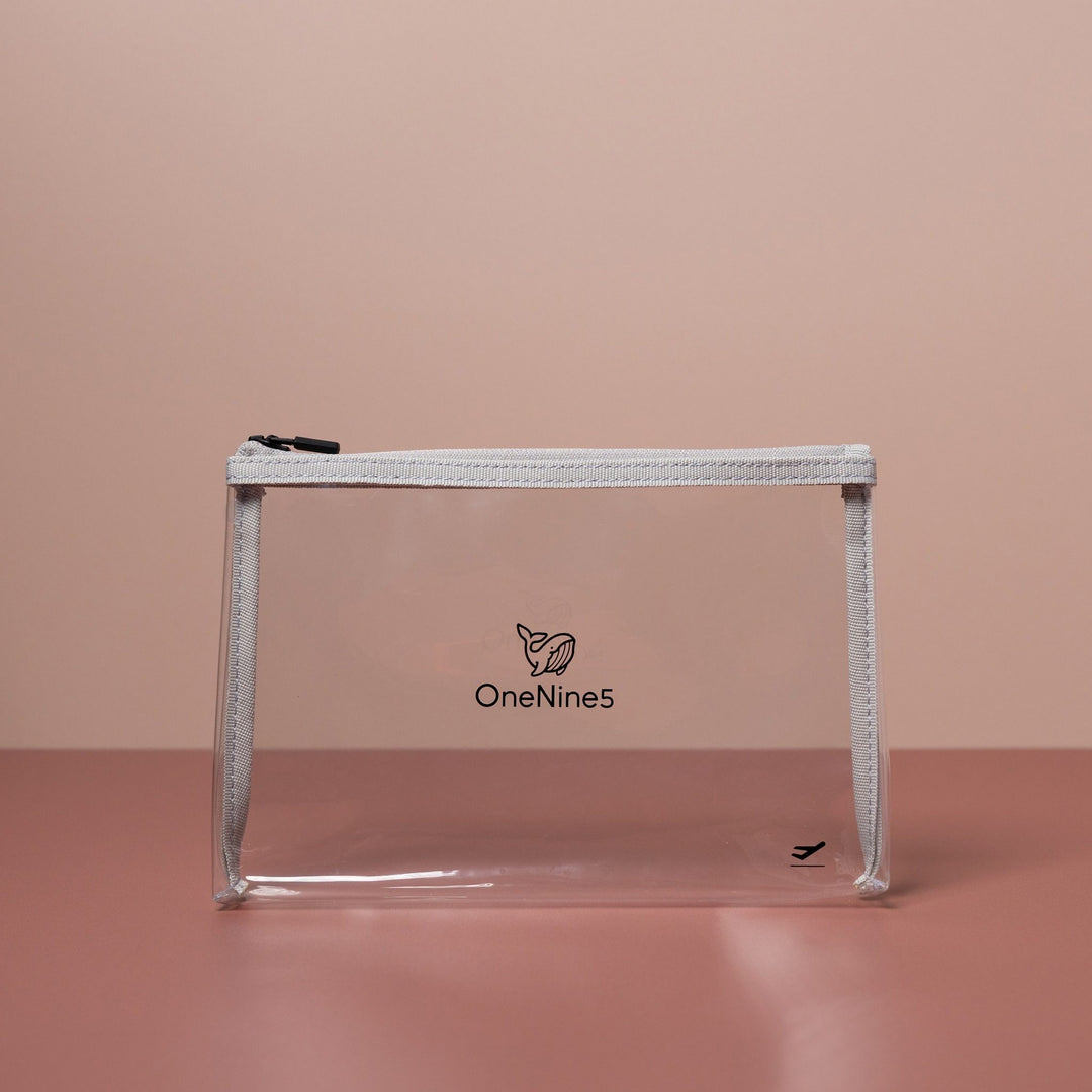Grey clear liquid bag for airport security shown front-on with transparent material and structured base