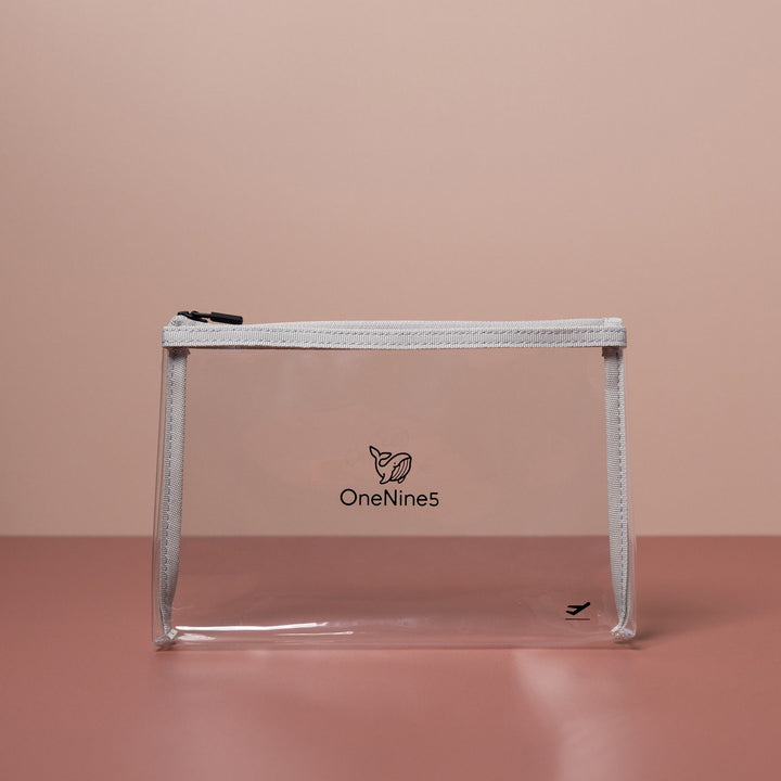 Grey clear liquid bag for airport security shown front-on with transparent material and structured base