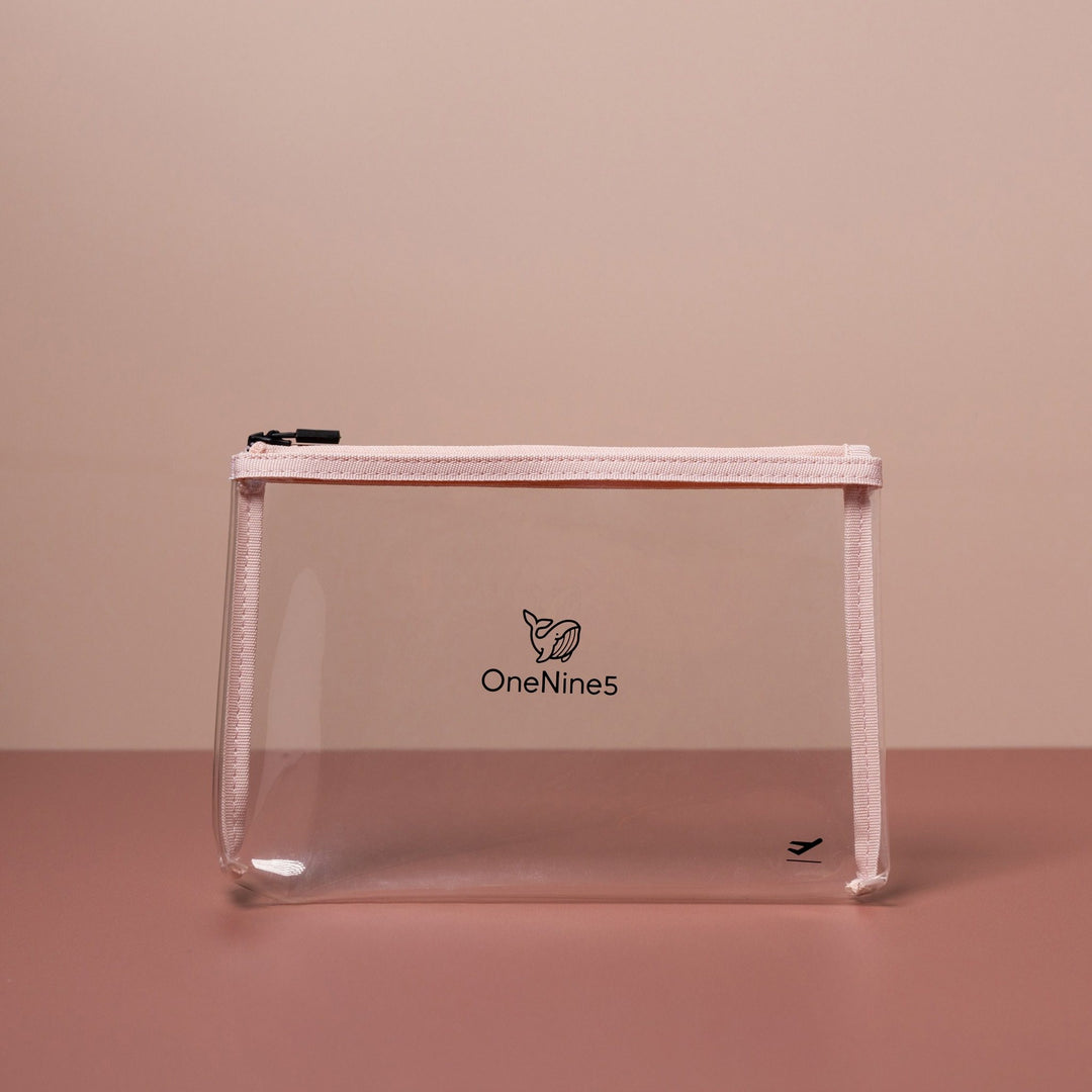 Pink clear liquid bag for airport security shown front-on with transparent body and structured silhouette