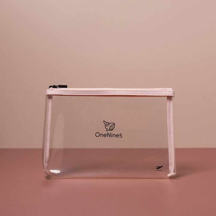 Pink clear liquid bag for airport security shown front-on with transparent body and structured silhouette