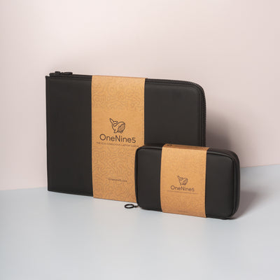 OneNine5 black coconut padded 13" Eco-Conscious Laptop Sleeve and vegan leather Eco Essentials Pouch. Packaged in a brown and recyclable kraft paper sleeve